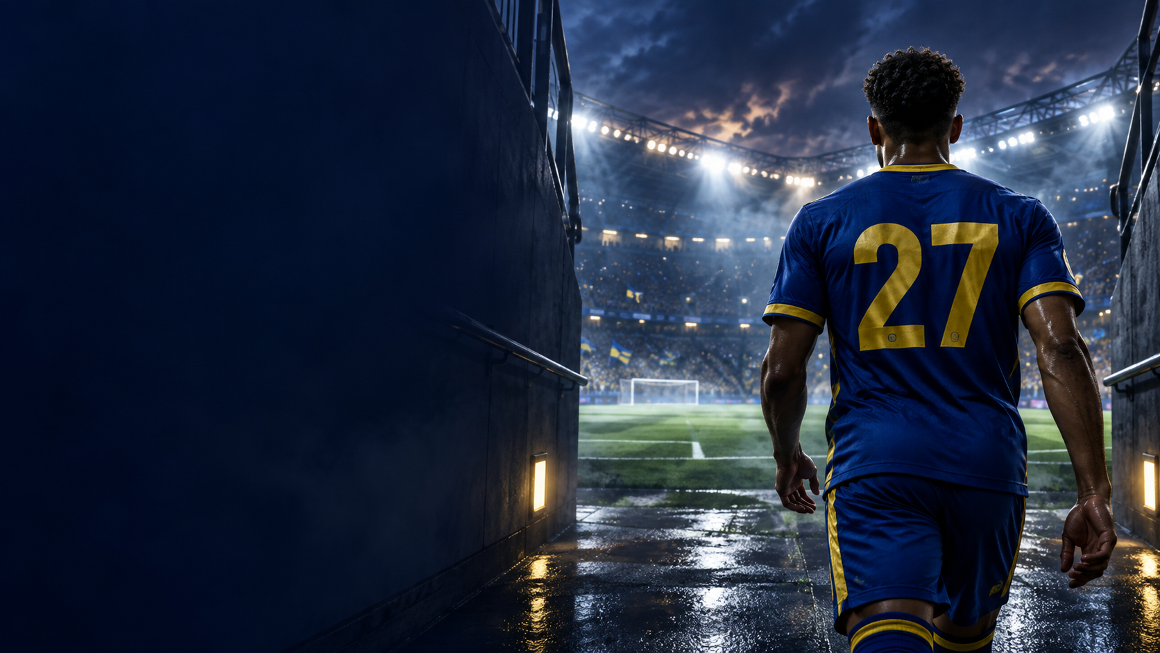A footballer in blue and yellow entering the stadium